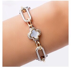 Stella Rose two tone link bracelet with mother-of-pearl clover-shaped accents.